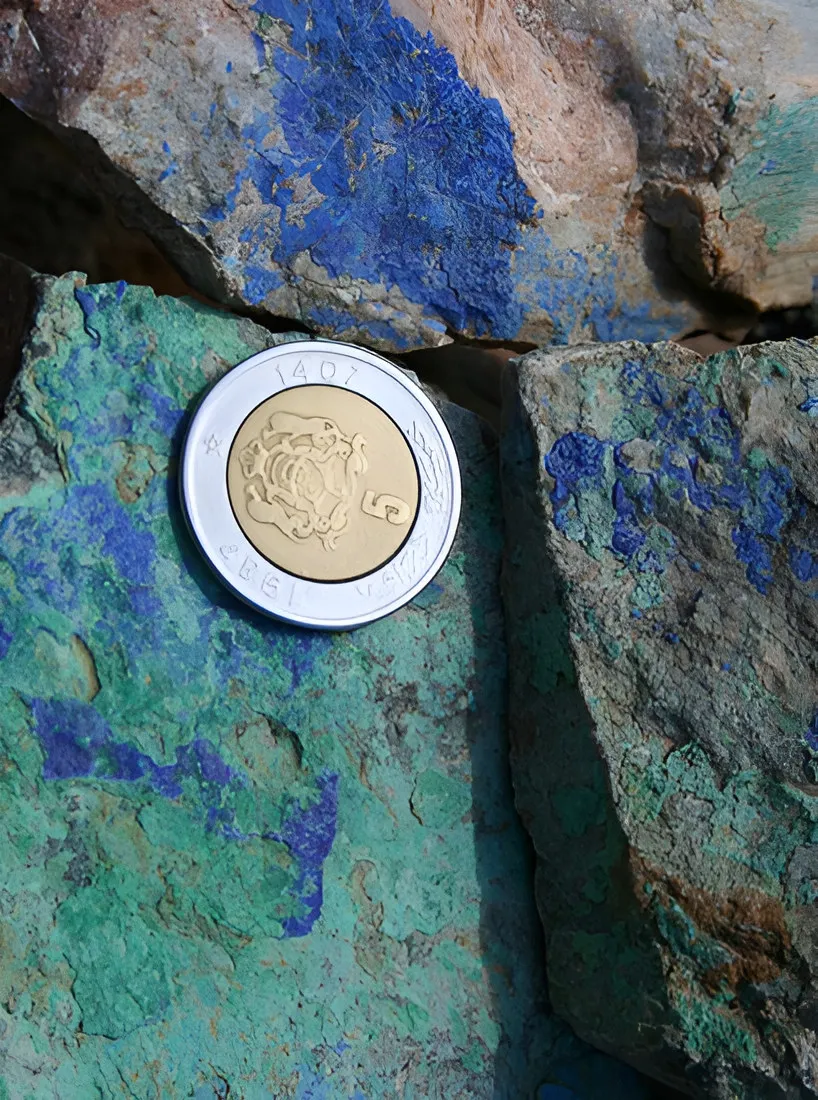Blue azurite and green malachite on rock, Alous, Morocco, with a coin for scale