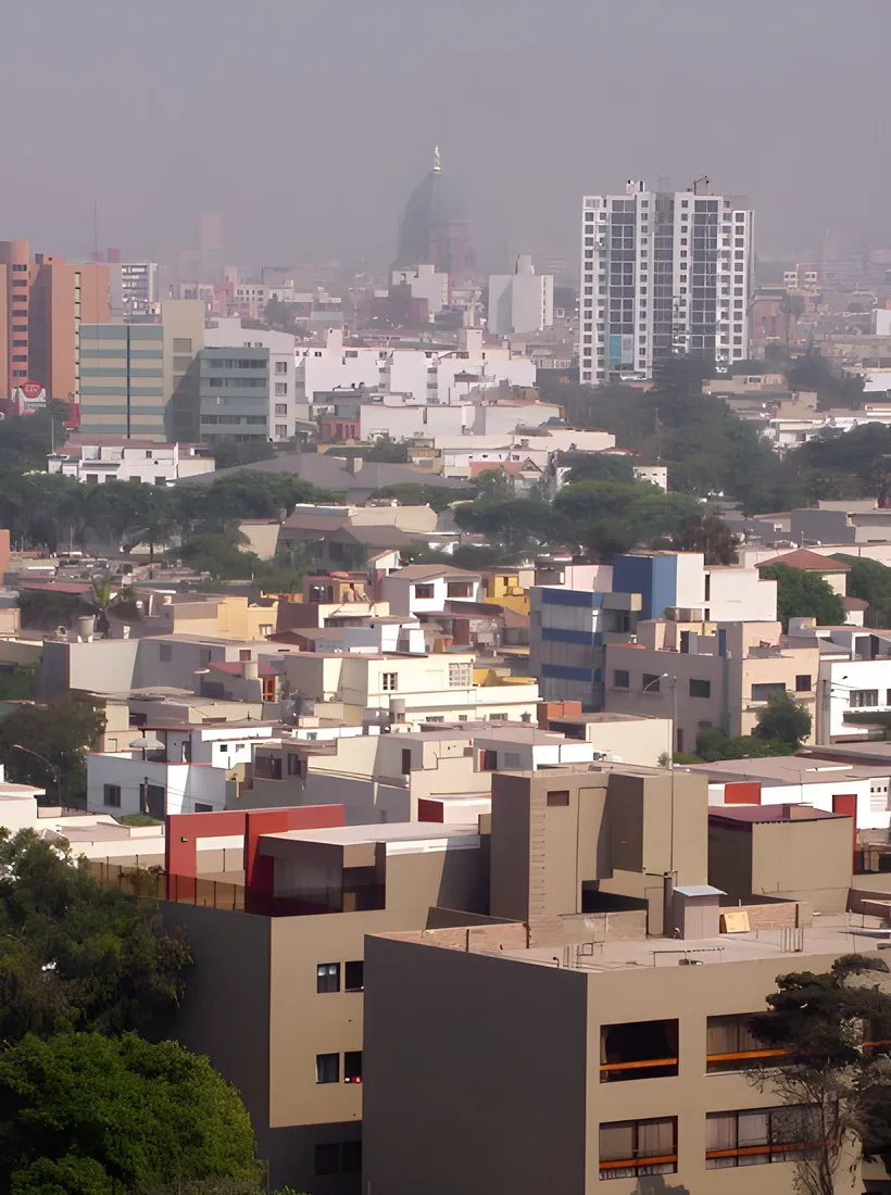 Rooftops and apartment blocks of Lima in the haze